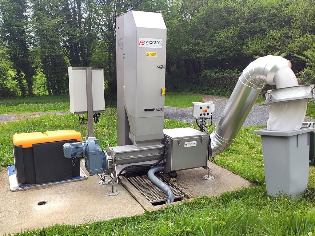 Presse laveuse qui compacte les déchets